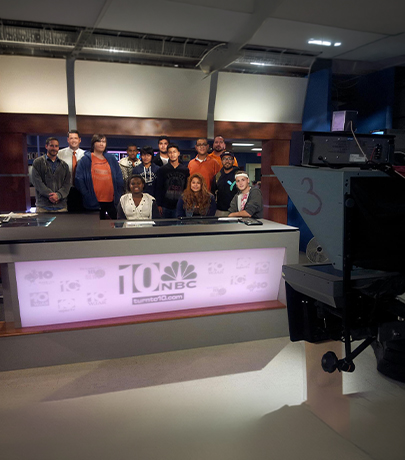 Students visiting television news studio